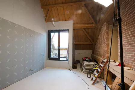 Transformatie monumentale schuur naar woningen
